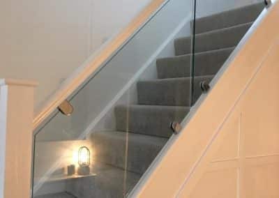 Finished stairwell for loft conversion - grey carpeted stairs