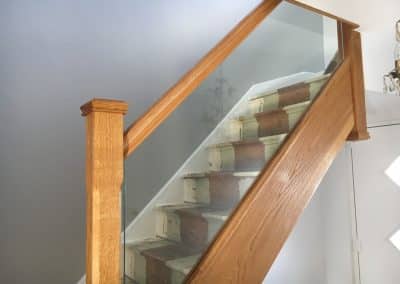 Stairwell for loft conversion - wooden handrail with glass panel