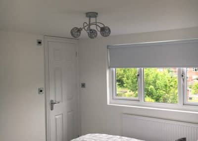 flat roof gable - bedroom conversion with white bedding