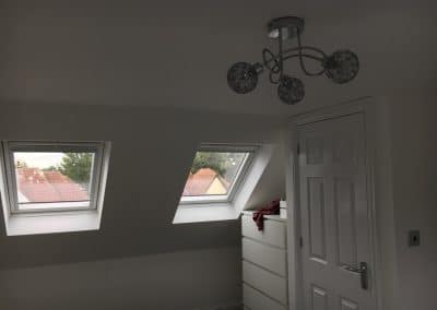 Flat roof gable - bedroom with 2 windows and white chest of drawers