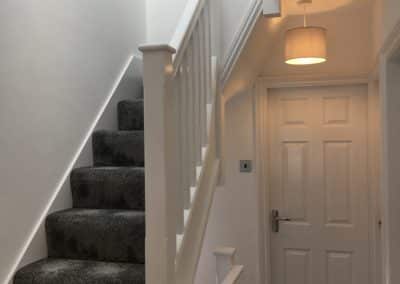 grey carpeted staircase to loft conversion