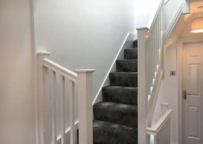 View of grey carpeted staircase to loft conversion