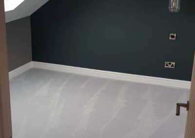 Loft conversion finished - grey carpet and dark walls
